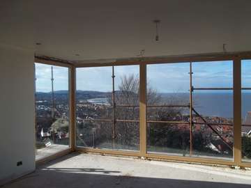 Mr & Mrs D. Colwyn Bay, North Wales : Internal view of an Installation of Internorm Alu Clad windows. Internal spruce with clear stain. 